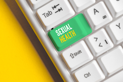 Computer keyboard with a caps lock key labeled sexual health.