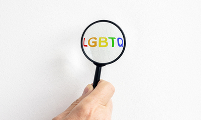 LGBTQ under a magnifier.