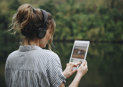 Woman using a tablet outside